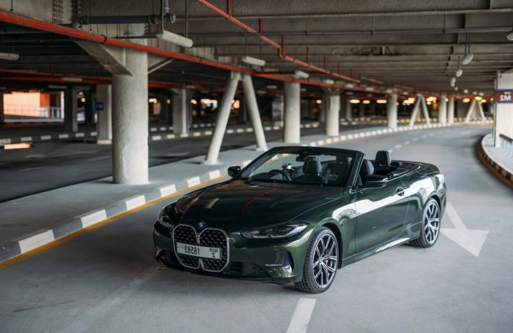 Stylish green BMW 430i Cabrio 2022 for rent in Dubai perfect for a unique and luxurious open-top driving experience