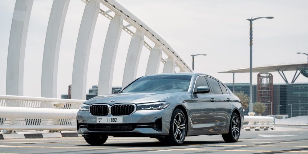 Elegant dark grey BMW 520i 2021 for rent in Dubai combining luxury comfort and smooth performance