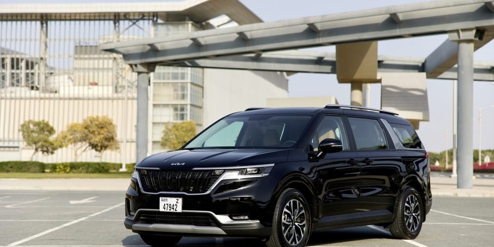 Spacious black KIA Carnival 2022 for rent in Dubai offering modern design advanced features and exceptional comfort for family or group travel
