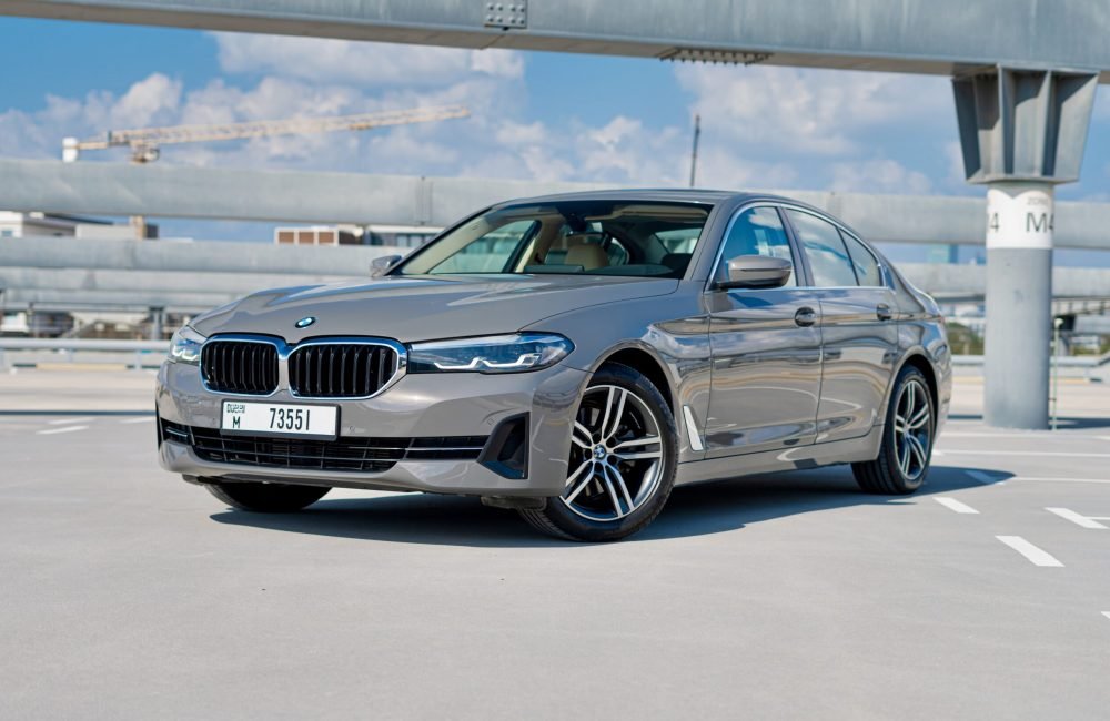 Sophisticated grey BMW 520i 2021 for rent in Dubai offering luxury comfort and exceptional performance
