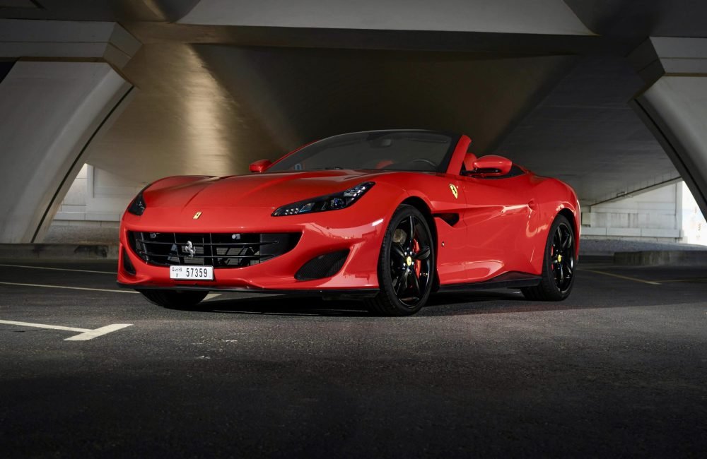 Exquisite red Ferrari Portofino 2019 with a rosso red roof for rent in Dubai offering unmatched luxury style and thrilling performance