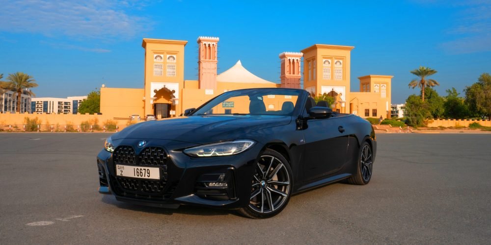 Elegant black BMW 430i Cabrio 2023 for rent in Dubai offering a premium and dynamic convertible driving experience