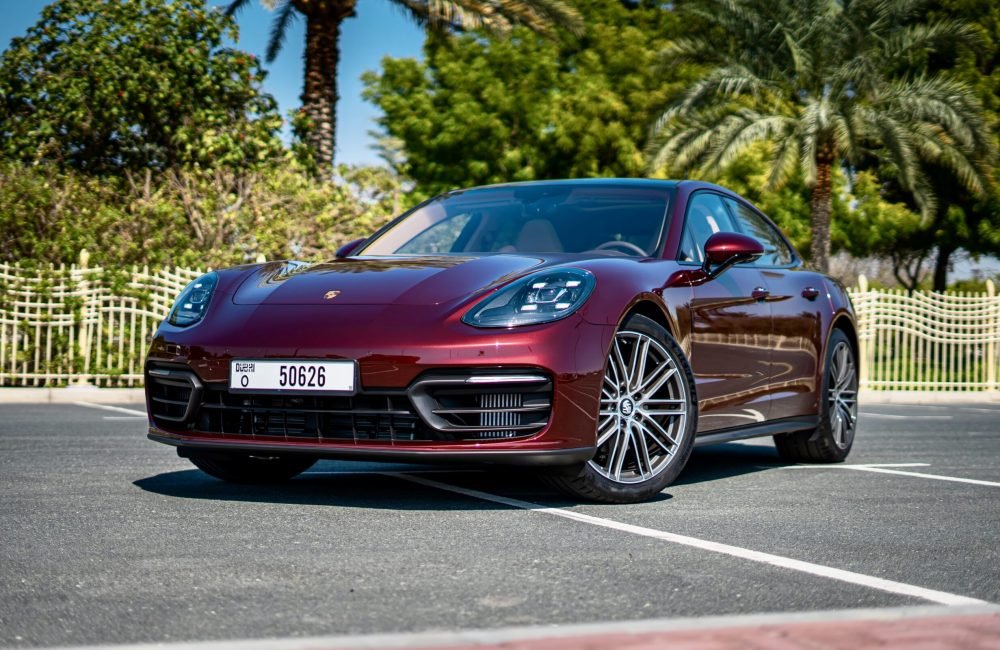 Luxurious maroon Porsche Panamera 2022 for rent in Dubai offering a premium driving experience with advanced features and dynamic performance