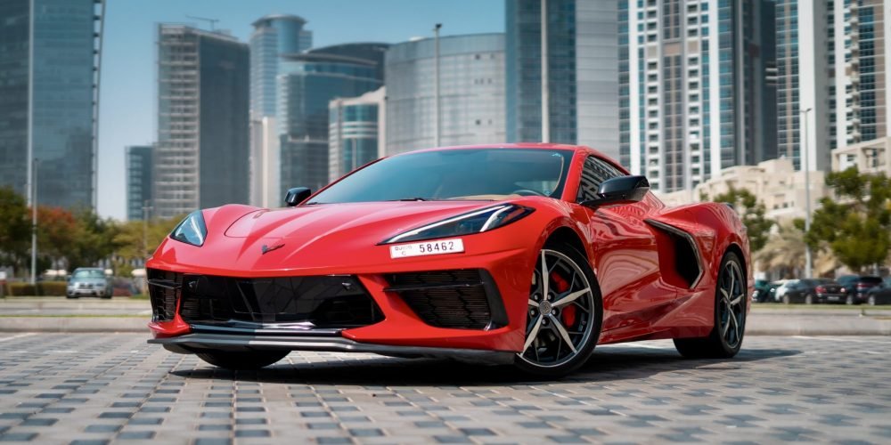 Sporty red Chevrolet Corvette C8 Spyder 2022 for rent in Dubai offering a thrilling open-top driving experience with unmatched performance and style
