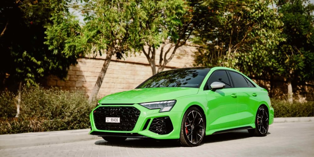 Striking green Audi RS3 2023 for rent in Dubai offering dynamic performance modern luxury and advanced features for a thrilling driving experience