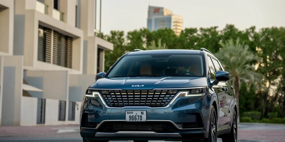 Spacious blue Kia Carnival 2023 for rent in Dubai offering modern design advanced features and exceptional comfort for family or group travel