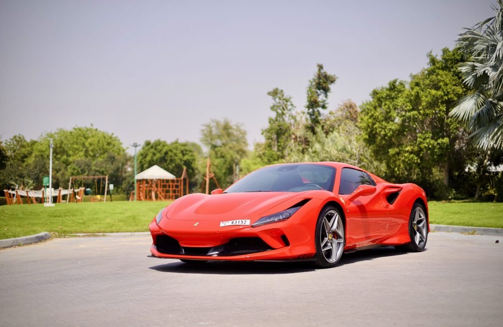 Iconic red Ferrari F8 Tributo Spider for rent in Dubai offering a thrilling open-top driving experience with exceptional performance luxurious design and advanced technology
