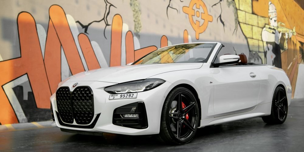Elegant white BMW 420 Convertible 2023 for rent in Dubai offering a luxurious open-top driving experience with advanced features and sporty performance