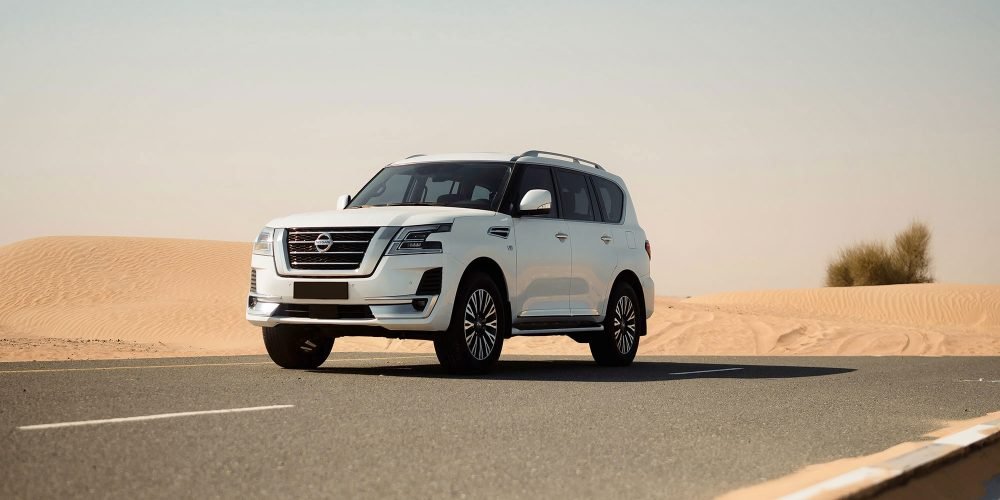 Elegant white Nissan Patrol for rent in Dubai offering spacious comfort advanced off-road capabilities and powerful performance for a versatile driving experience