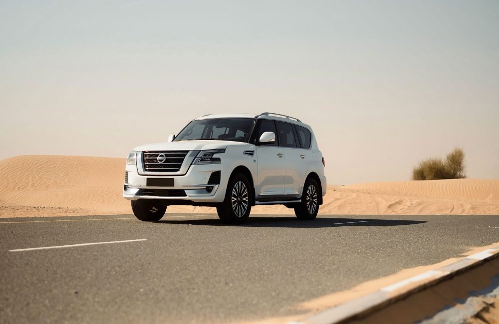 Elegant white Nissan Patrol for rent in Dubai offering spacious comfort advanced off-road capabilities and powerful performance for a versatile driving experience
