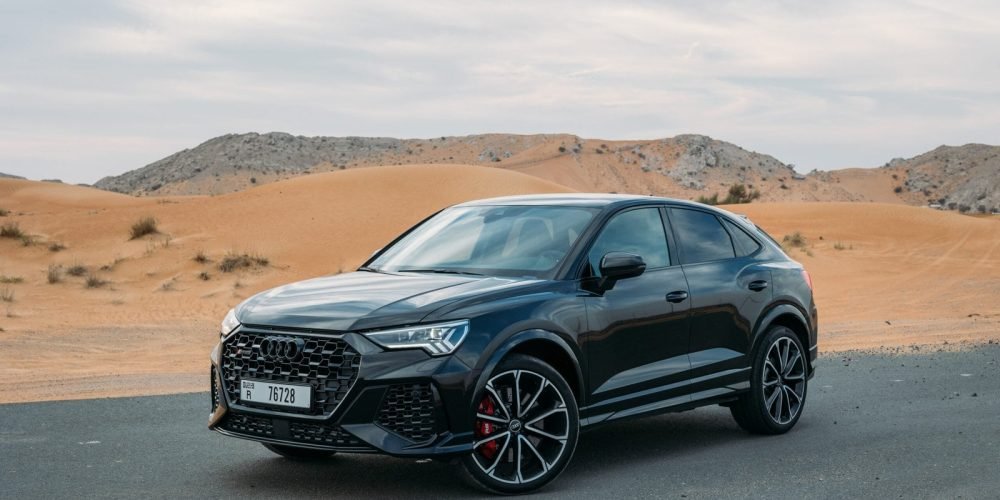 Luxury black Audi RSQ3 2023 available for rent in Dubai, premium SUV with sleek design and powerful performance.