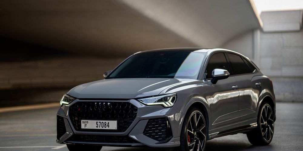Sporty grey Audi RS Q3 for rent in Dubai offering dynamic performance modern design and advanced features for a thrilling and luxurious driving experience