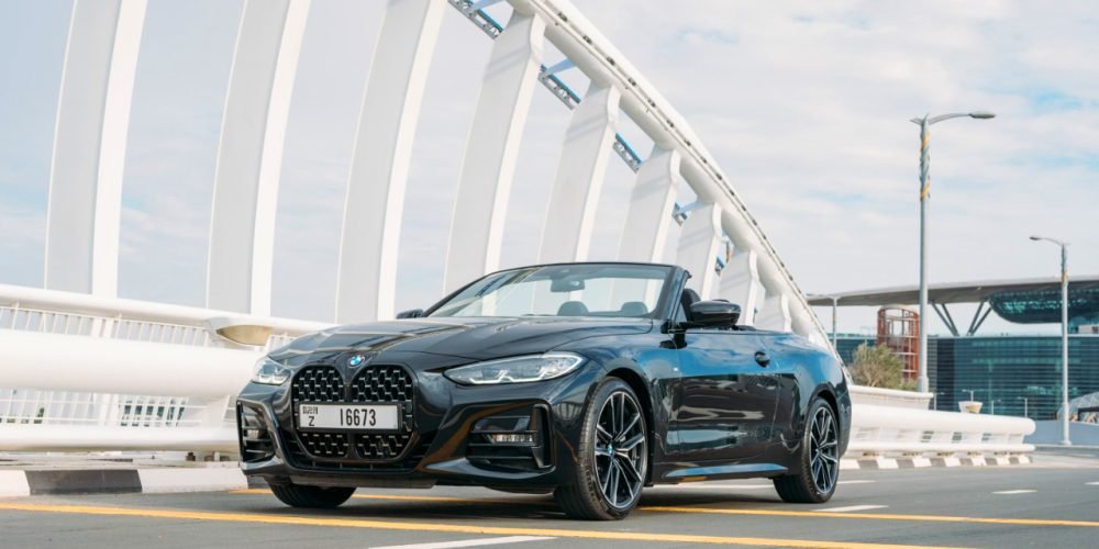 Sleek black BMW 430i Cabrio 2023 for rent in Dubai offering a perfect blend of luxury and sporty performance