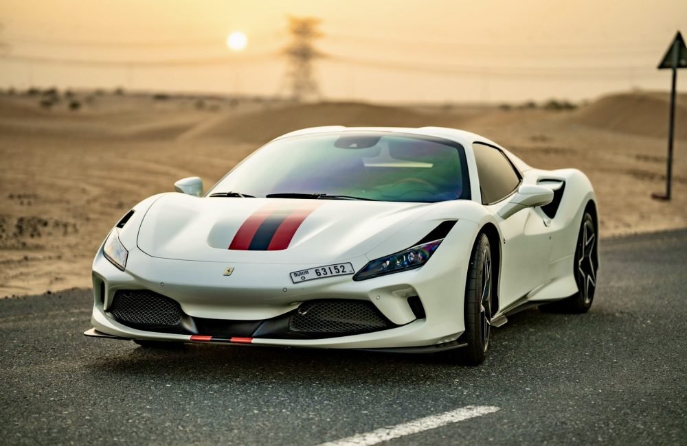Elegant white Ferrari F8 Tributo Spider for rent in Dubai offering a luxurious open-top driving experience with high-performance engineering sleek design and advanced technology