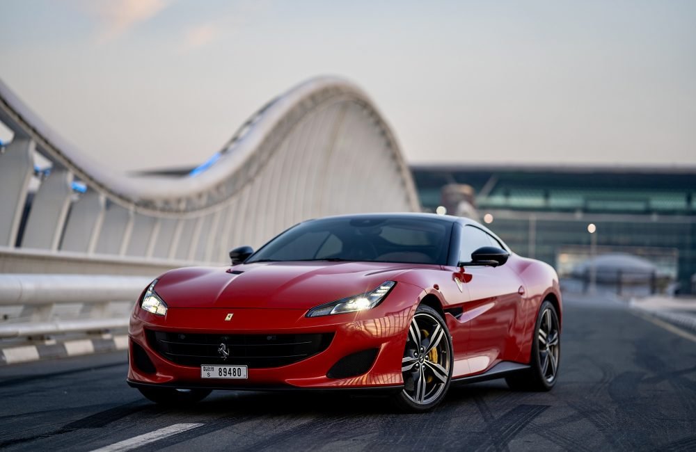 Iconic red Ferrari Portofino for rent in Dubai offering a luxurious open-top driving experience with high-performance engineering sleek design and advanced technology