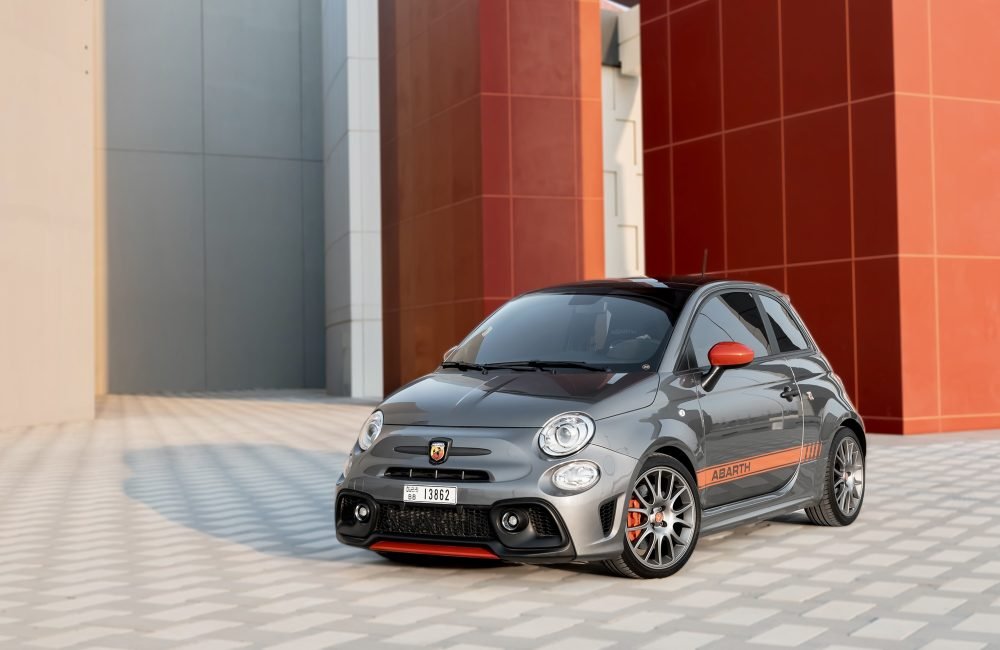 Sporty grey Fiat Abarth 695 Turismo 2023 for rent in Dubai offering compact design high-performance agility and Italian style for a fun and dynamic driving experience
