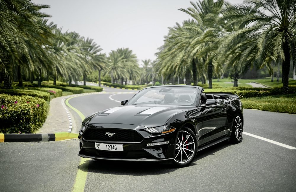 Sleek black Ford Mustang for rent in Dubai offering powerful performance modern features and an iconic design for an exhilarating driving experience