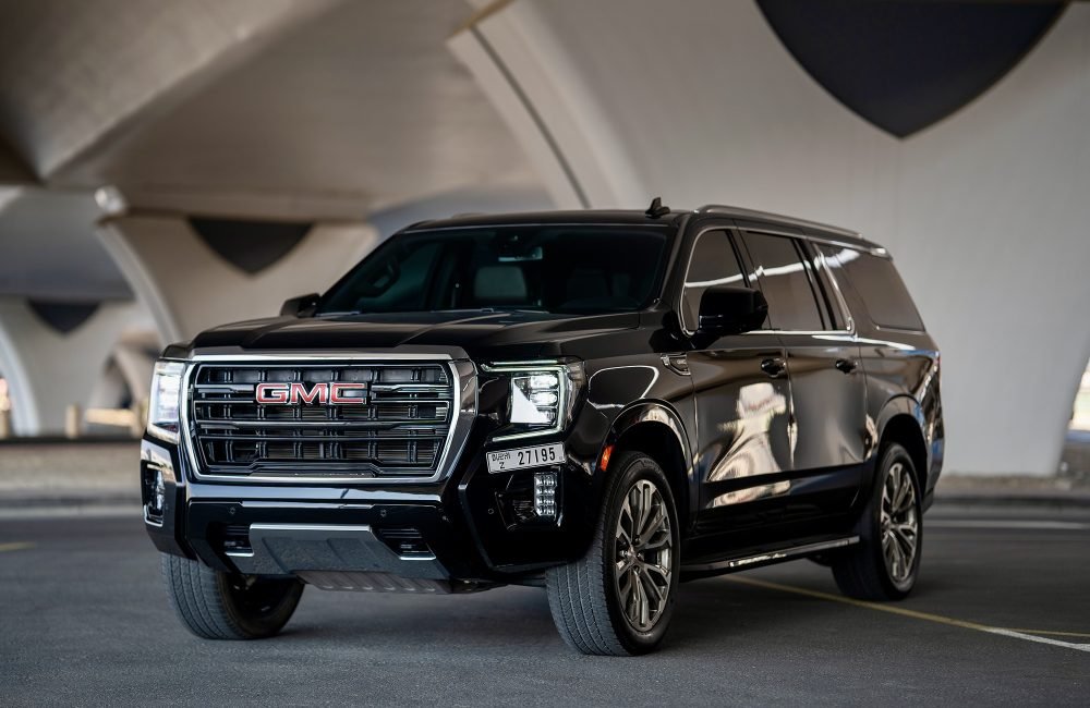 Luxurious black GMC Yukon XL 2023 for rent in Dubai offering spacious comfort advanced technology and powerful performance for an exceptional driving experience