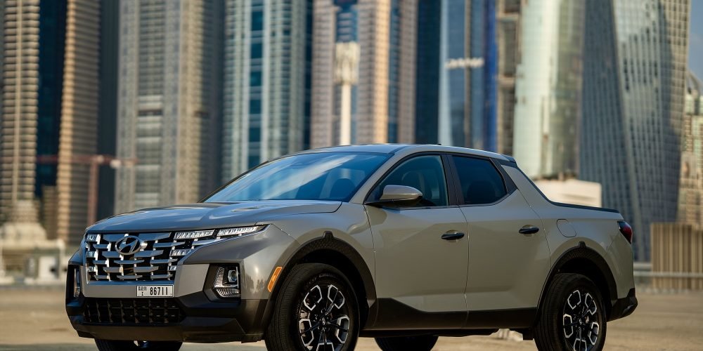 Versatile grey Hyundai Santa Cruz for rent in Dubai offering a unique blend of SUV comfort and pickup utility with modern features and smooth performance for all types of journeys