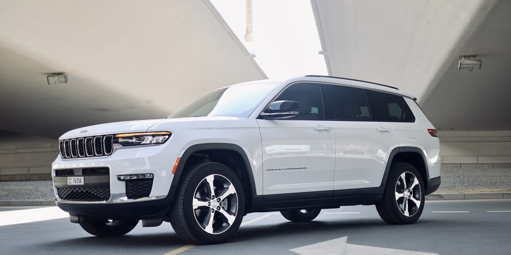 Elegant white Jeep Grand Cherokee 2023 for rent in Dubai offering a perfect blend of luxury comfort advanced technology and off-road capability for a versatile driving experience