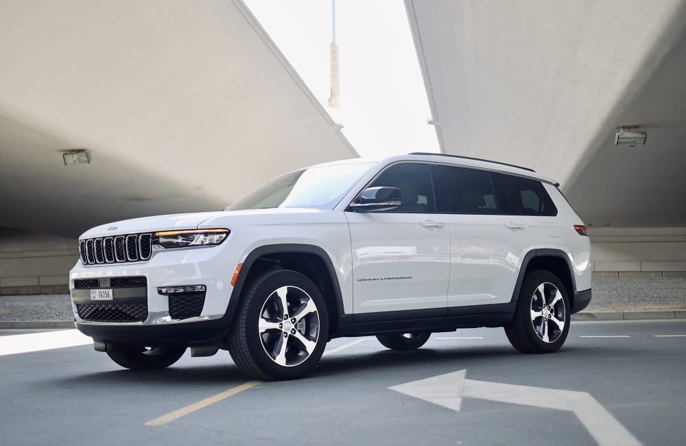 Elegant white Jeep Grand Cherokee 2023 for rent in Dubai offering a perfect blend of luxury comfort advanced technology and off-road capability for a versatile driving experience