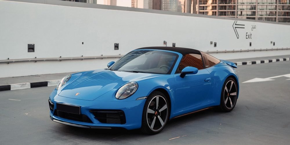 Stylish blue Porsche 911 Targa 4S 2022 for rent in Dubai offering a unique open-roof design high-performance engineering and luxurious comfort for an exceptional driving experience