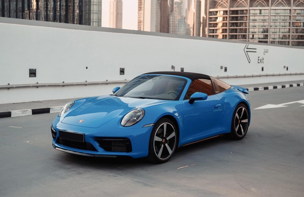 Stylish blue Porsche 911 Targa 4S 2022 for rent in Dubai offering a unique open-roof design high-performance engineering and luxurious comfort for an exceptional driving experience